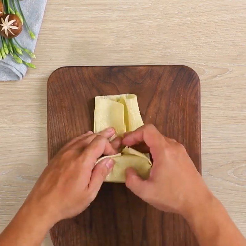 Step 3 Stuff the mushroom filling and wrap it in tofu skin Tofu with mushroom filling braised in coconut water