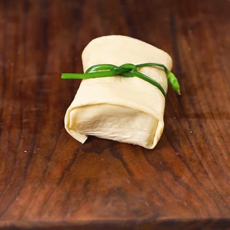 Step 3 Stuff the mushroom filling and wrap it in tofu skin Tofu with mushroom filling braised in coconut water