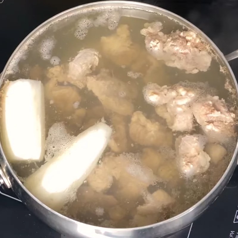 Step 3 Simmer the broth for Pork Intestine Noodle Soup