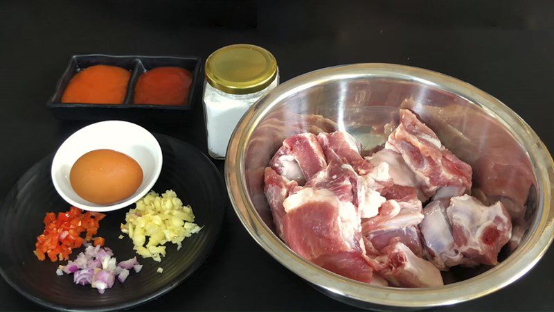 Ingredients for sweet and sour ribs dish with honey, lime, and lime leaves