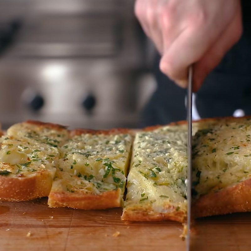 Step 4 Spread butter and toast the bread Caesar salad garlic butter bread