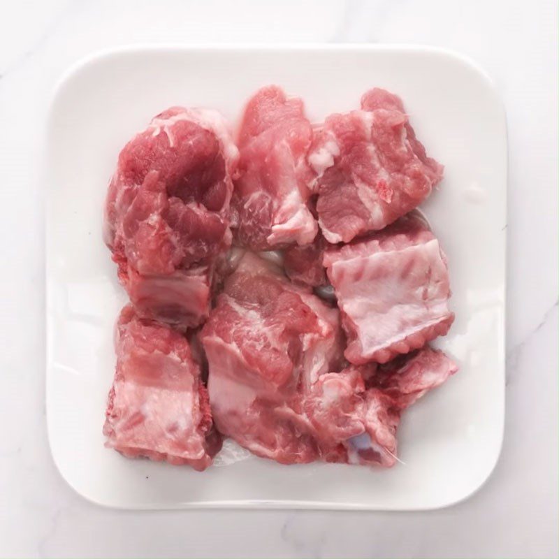 Step 1 Prepare the pork ribs for Taro Soup with Water Spinach