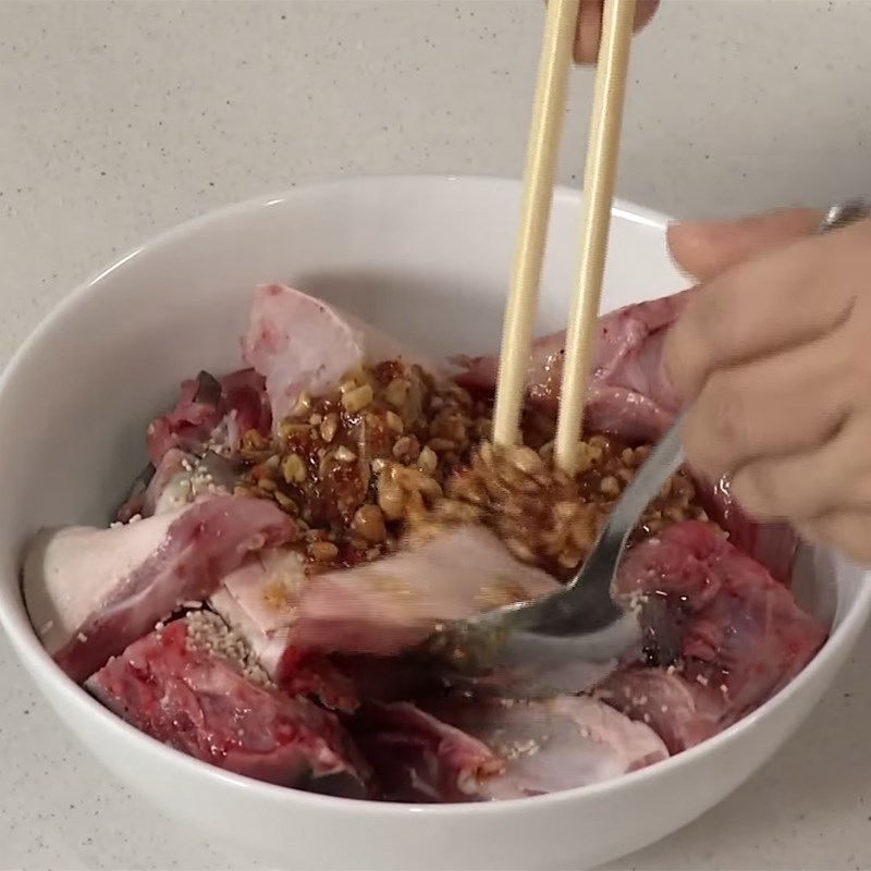 Step 2 Prepare and marinate the barramundi head Barramundi hotpot with water spinach