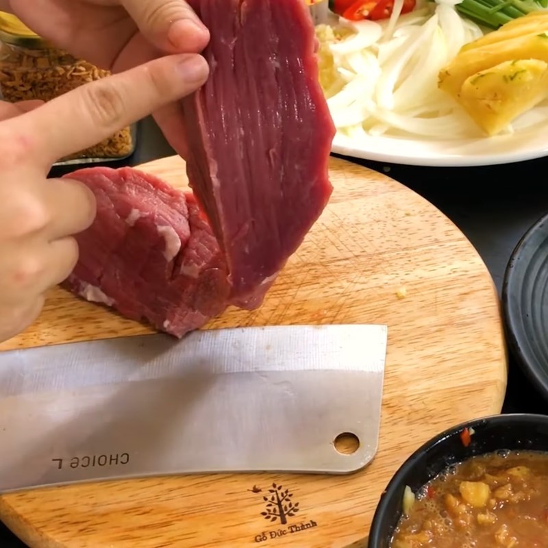 Step 3 Preparation and marinating beef Beef dipped in tamarind