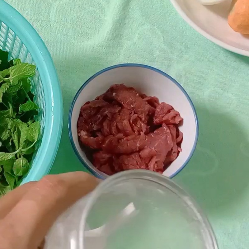 Step 1 Prepare and marinate the beef for Beef Salad with Herbs