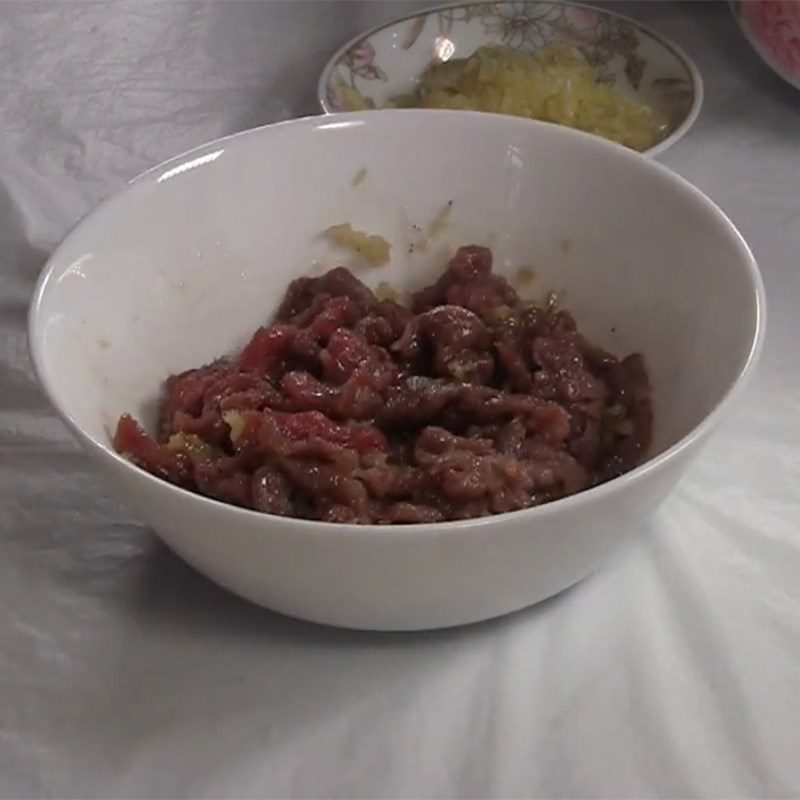 Step 2 Preparation and marinating beef Watercress mixed with beef