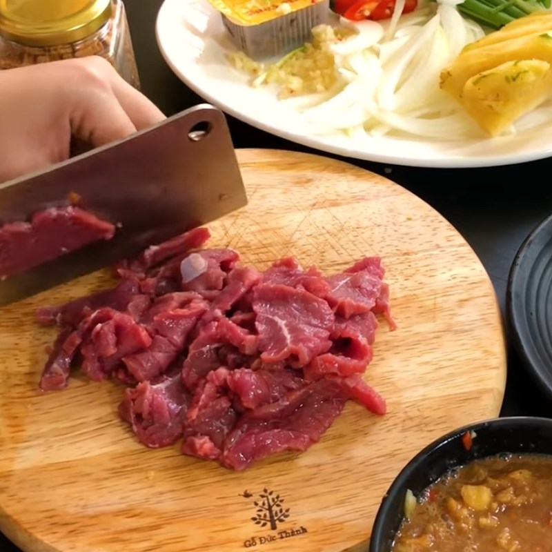 Step 3 Preparation and marinating beef Beef dipped in tamarind