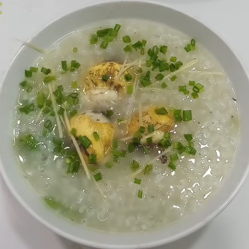 Step 5 Final product Duck egg porridge with mustard greens