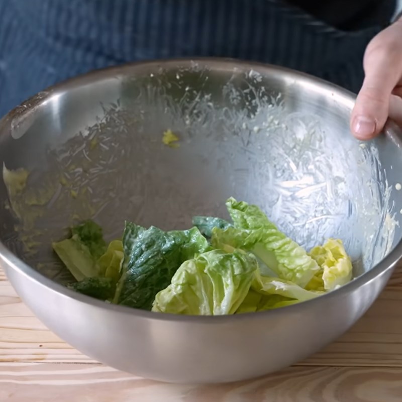 Step 5 Mixing salad Caesar salad garlic bread
