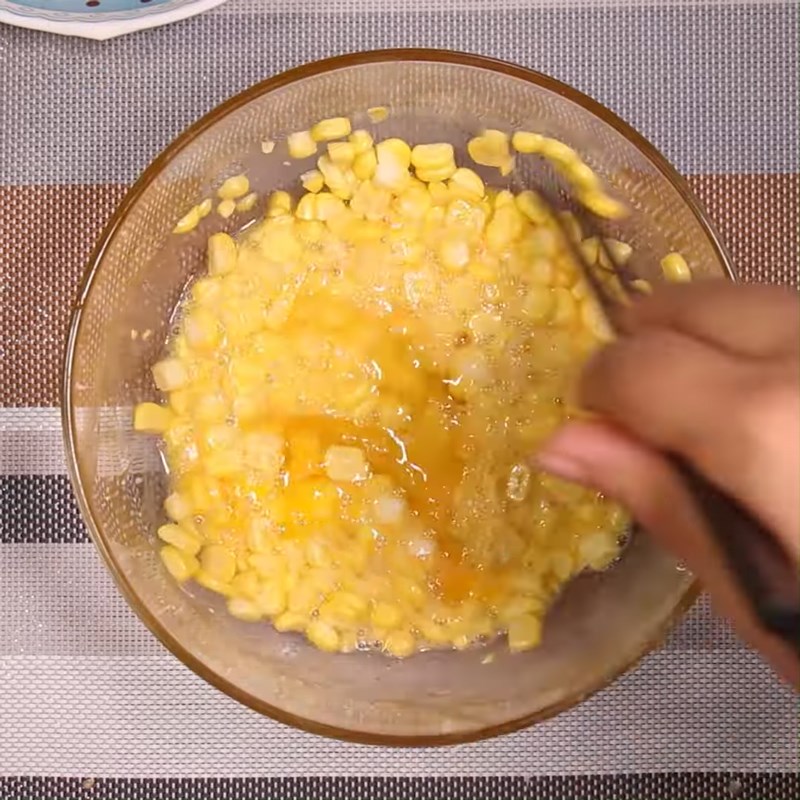Step 2 Mix eggs with corn for Fried Corn (Maize) Eggs and Sausages