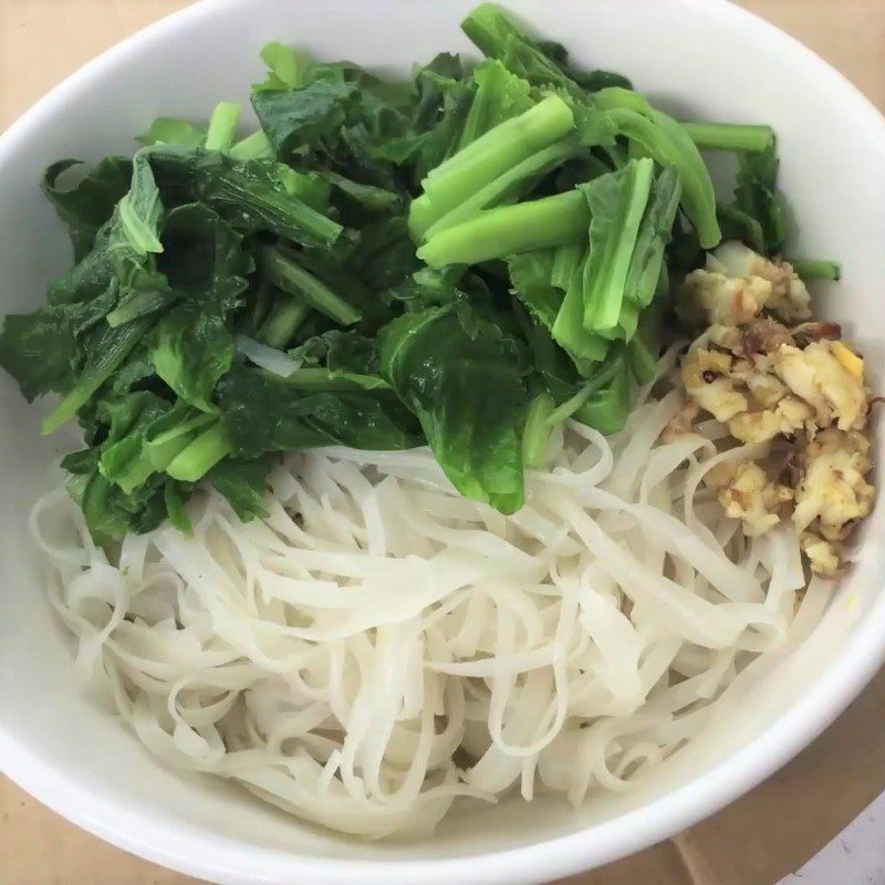Step 6 Blanching noodles and finishing Fish noodle soup with mustard greens