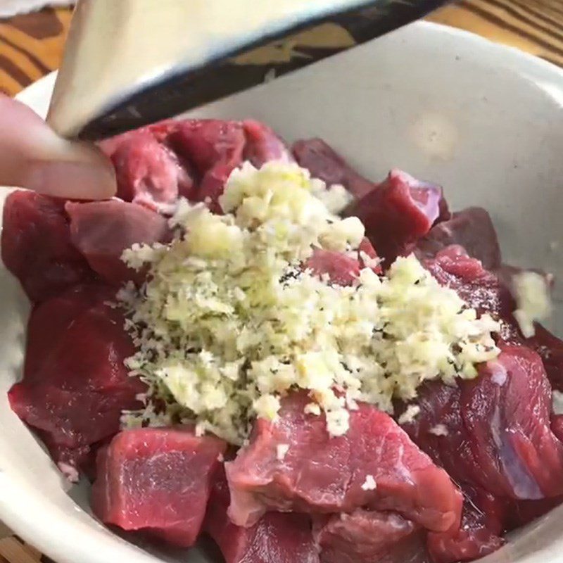 Step 1 Marinate the beef for Spicy Beef Hotpot (Recipe shared from TikTok Cooking with TasteVN)