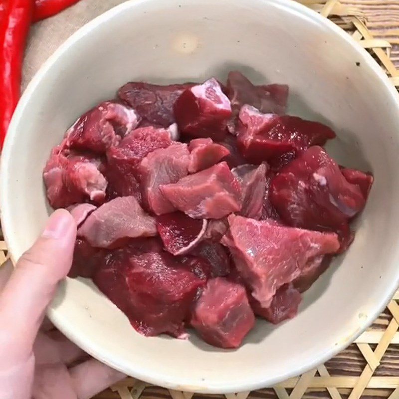 Step 1 Marinate the beef for Spicy Beef Hotpot (Recipe shared from TikTok Cooking with TasteVN)