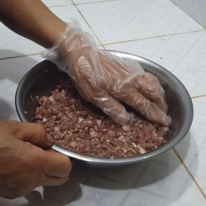 Step 2 Marinate the buffalo meat Buffalo meat wrapped in wild betel leaves grilled