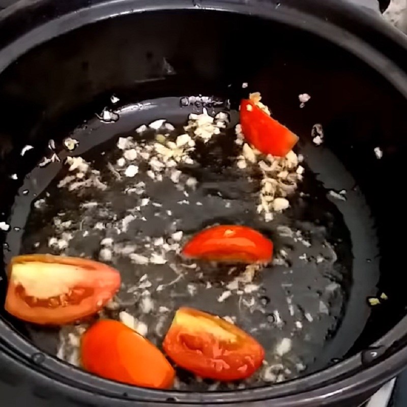 Step 3 Sauté tomatoes for Red tilapia stew