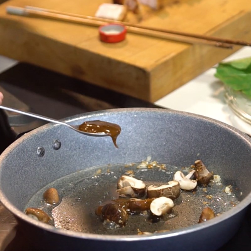Step 2 Stir-fry shiitake mushrooms for Roasted Pork Stir-Fried with Mustard Greens