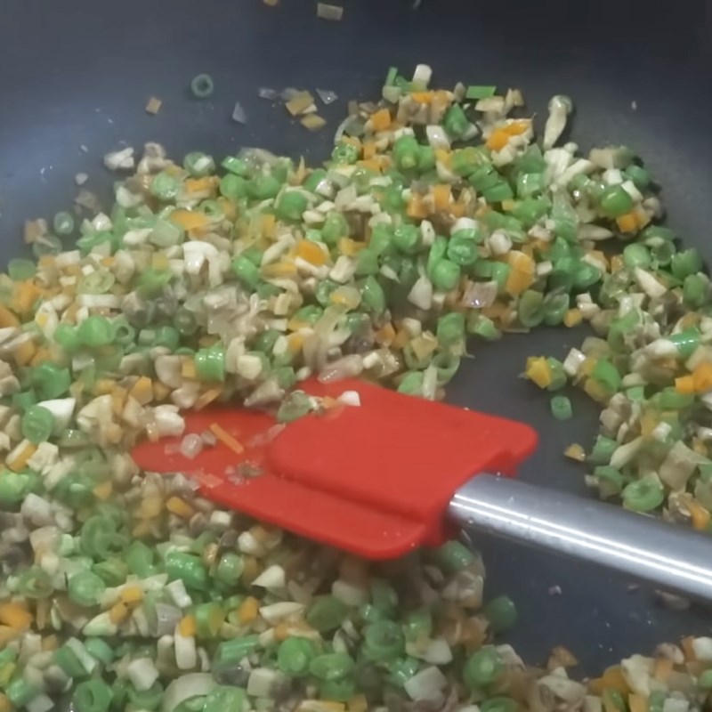 Step 2 Sauté ingredients for colorful fried egg rolls