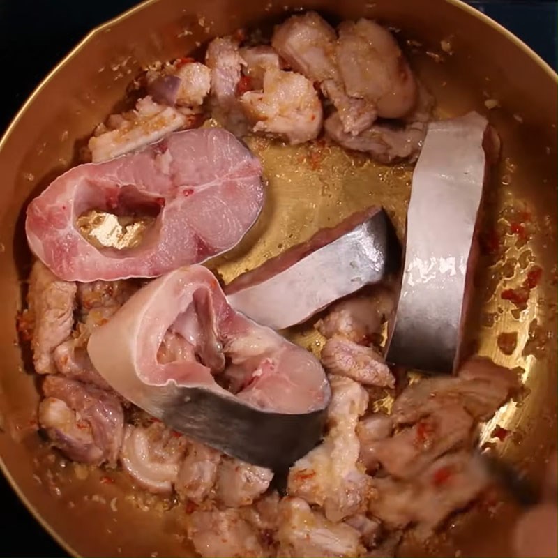 Step 3 Sauté the meat with basa fish for Mắm Ruốc Hotpot