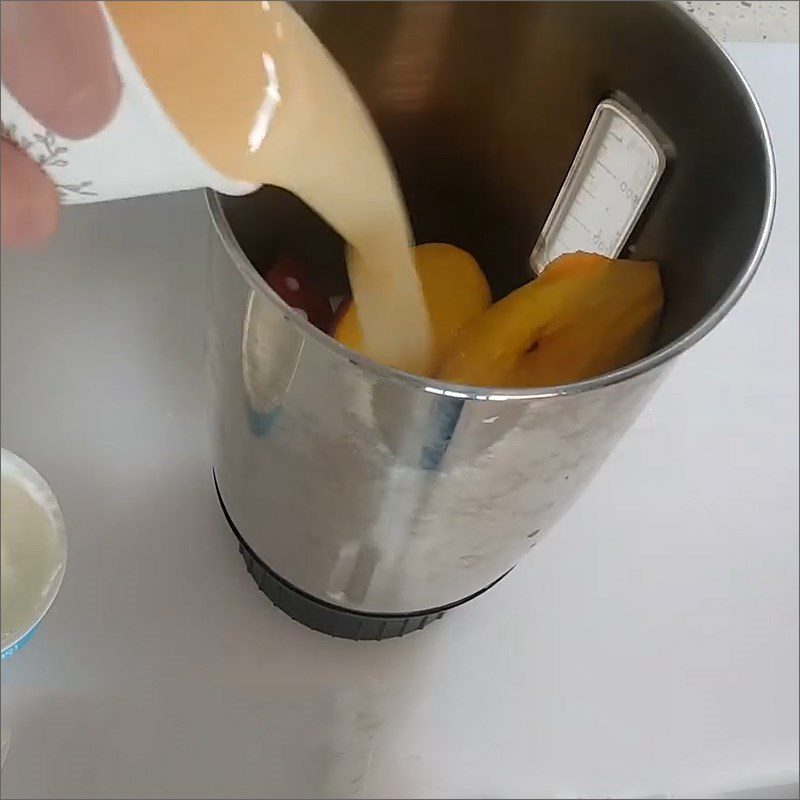 Step 2 Blend the ingredient mixture for Yogurt Peach Smoothie