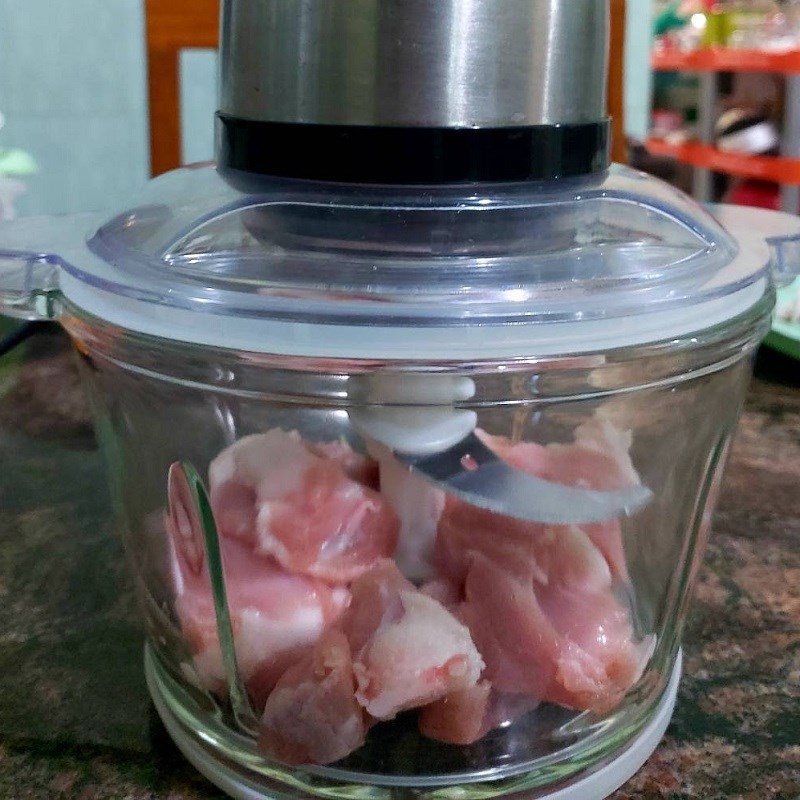 Step 2 Grinding and marinating meat for Pork Sausage Wrapped in Betel Leaves