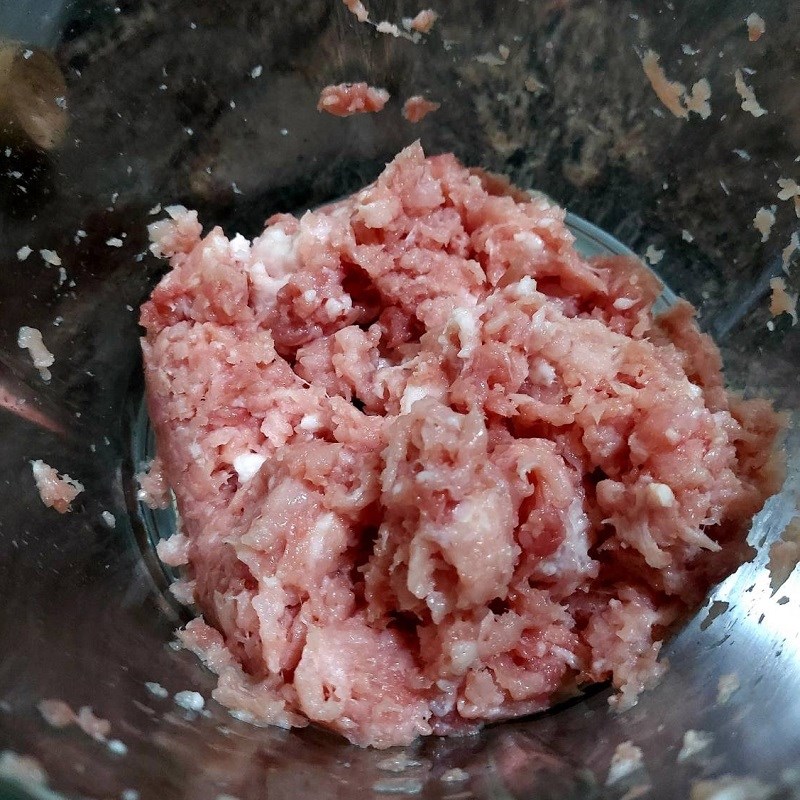 Step 2 Grinding and marinating meat for Pork Sausage Wrapped in Betel Leaves