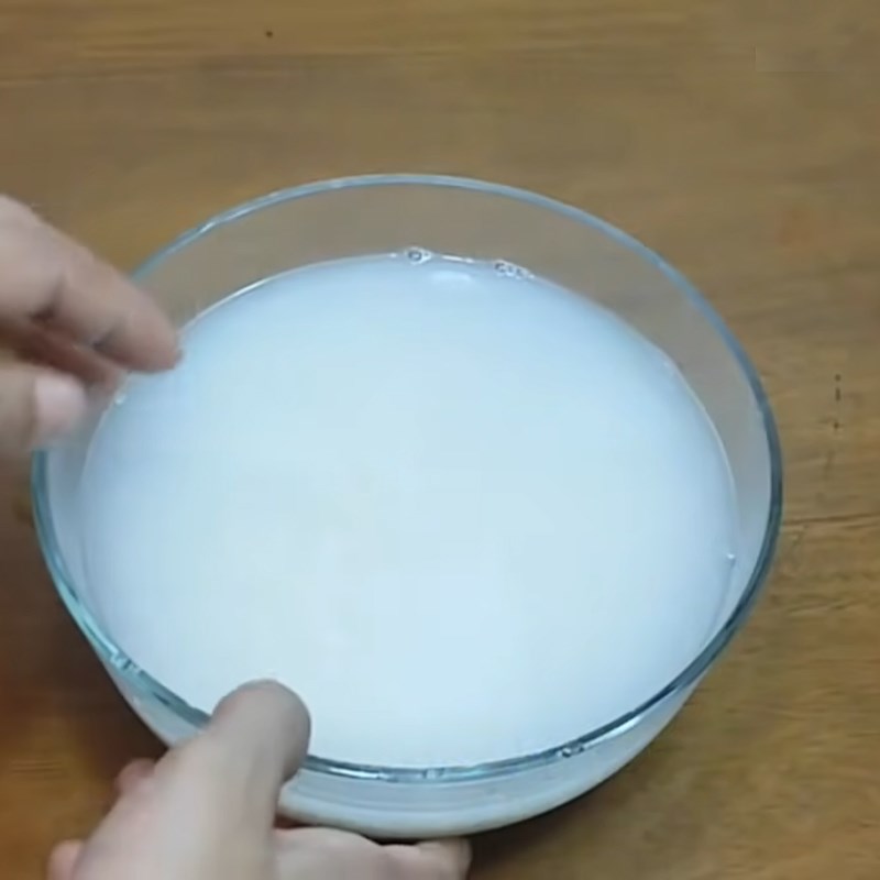 Step 1 Wash rice to get water for Western Pickled Melon
