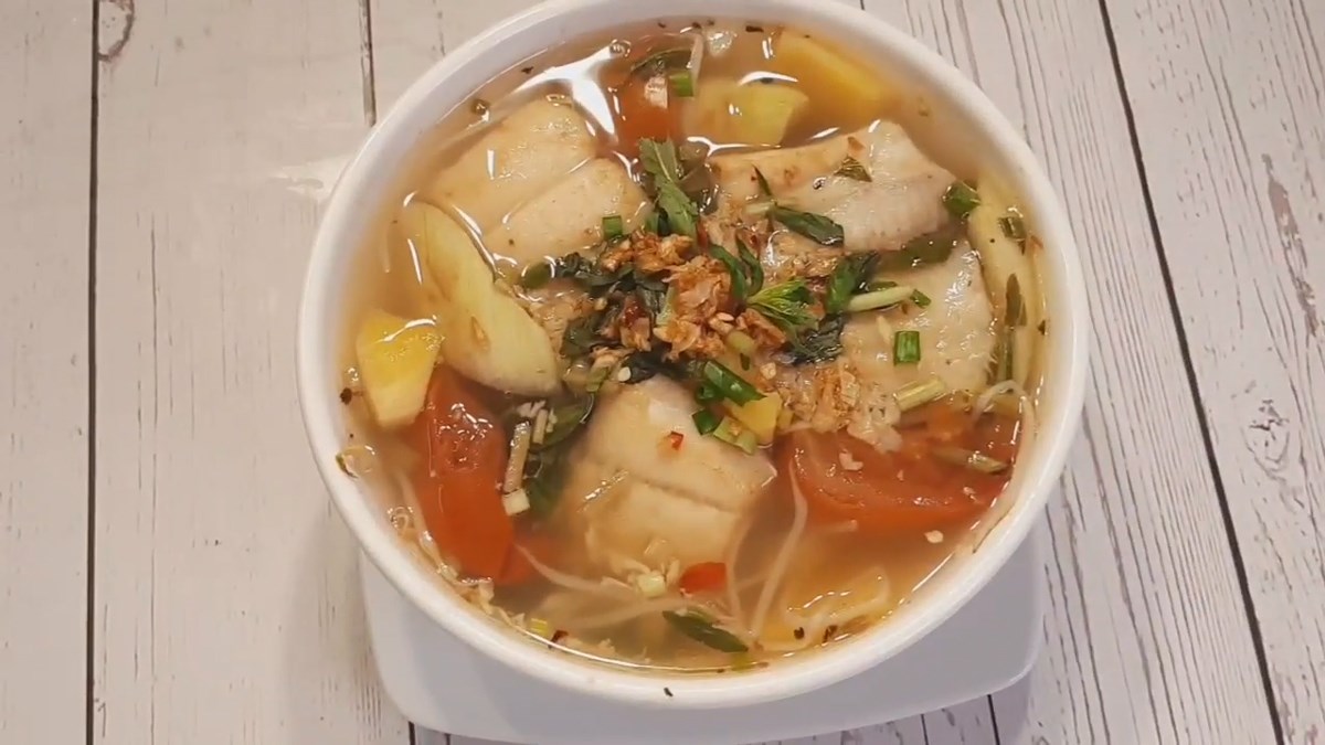 Sweet and sour dried fish soup with water spinach