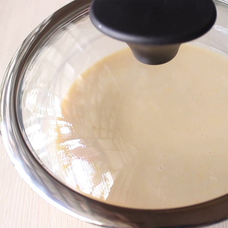 Step 2 Whisking eggs and sifting flour for Malaysian steamed cake