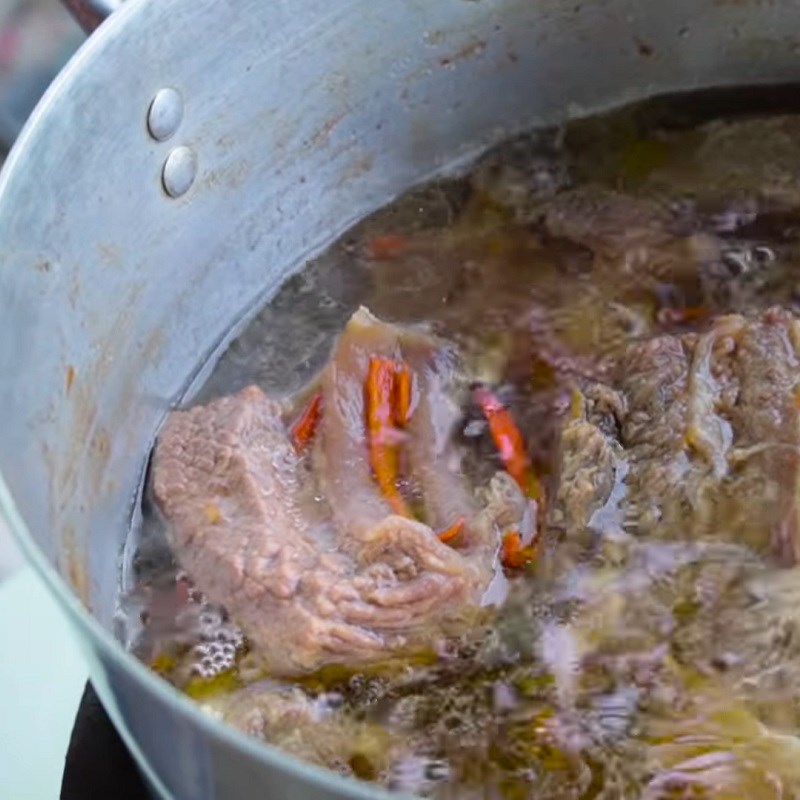 Step 4 Braising meat Buffalo meat braised in clay pot