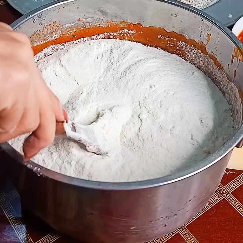 Step 3 Stir the flour into the gac mixture Gac lam cake