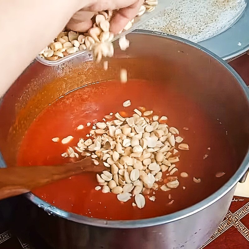 Step 3 Stirring the flour into the gac mixture Gac lam dessert