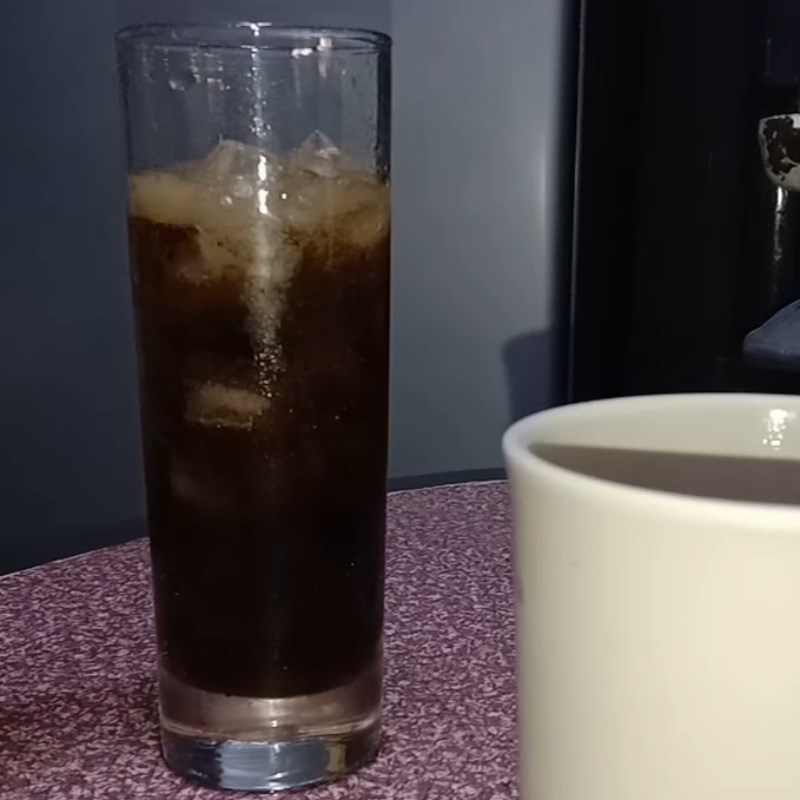 Step 2 Stirring Milo with Coca Cola Milo mixed with Coca Cola