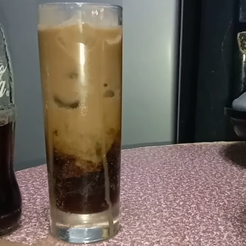 Step 2 Stirring Milo with Coca Cola Milo mixed with Coca Cola