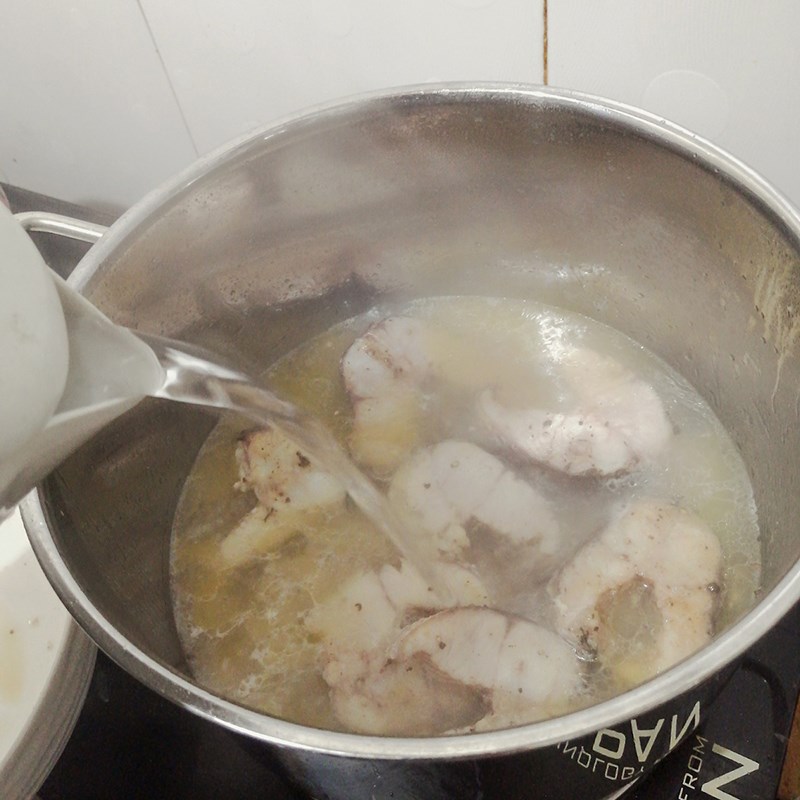 Step 4 Cook the broth for snakehead fish noodle Kiên Giang