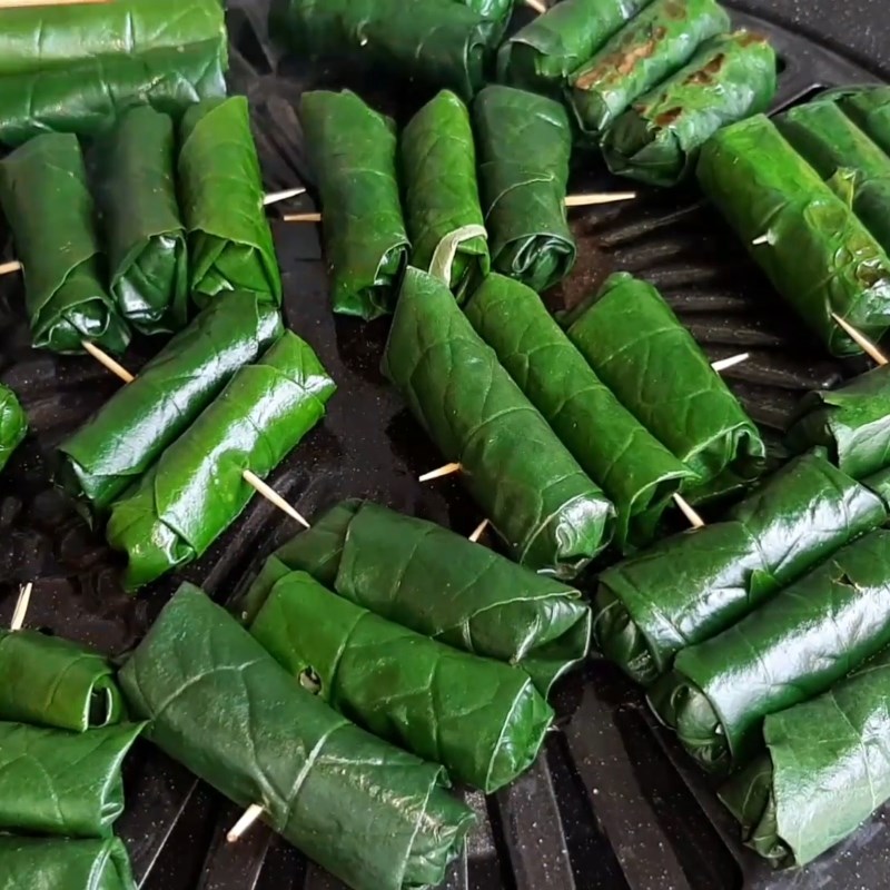 Step 6 Grilling frog meat Grilled frog meat wrapped in wild betel leaves
