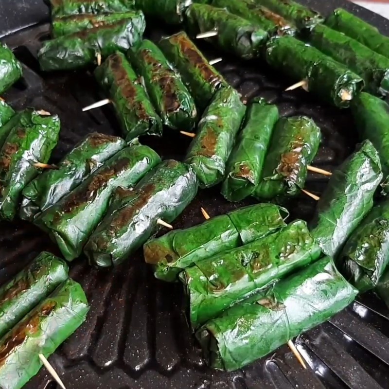 Step 6 Grilling frog meat Grilled frog meat wrapped in wild betel leaves
