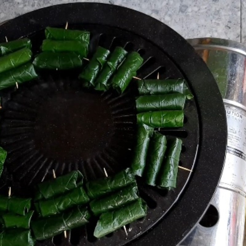 Step 6 Grilling frog meat Grilled frog meat wrapped in wild betel leaves