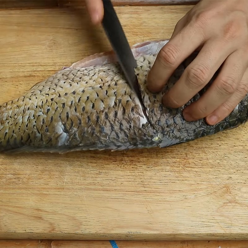 Step 1 Prepare the carp for Carp Hot Pot with Pickled Vegetables
