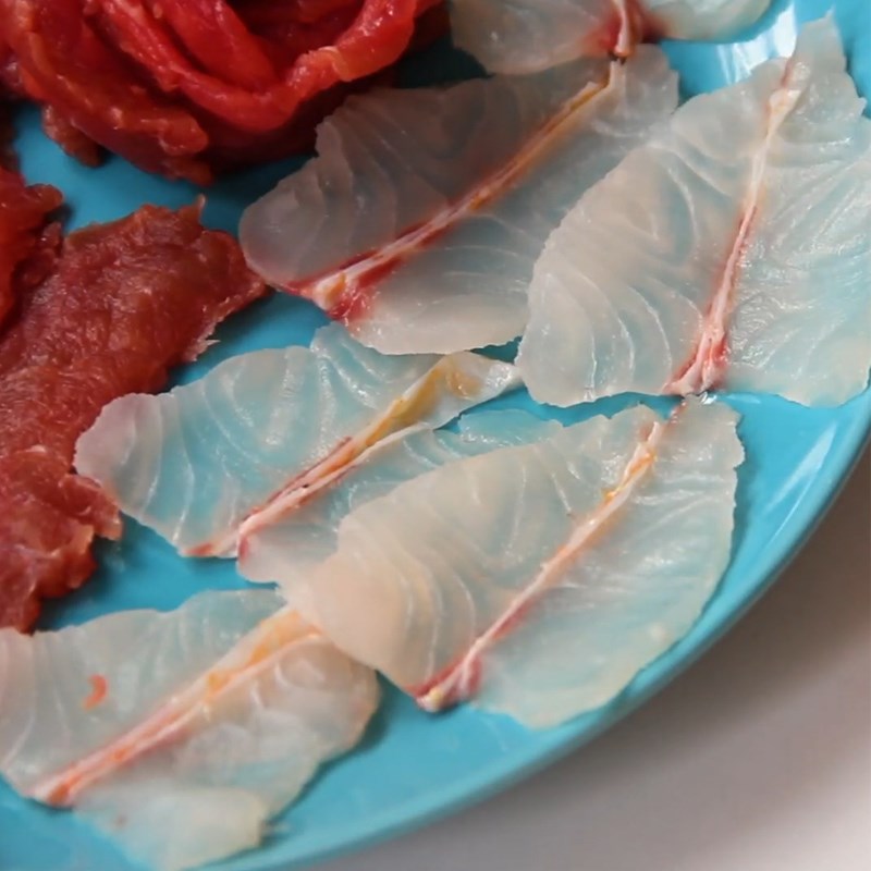 Step 2 Prepare the types of meat and fish for Tomato Hotpot