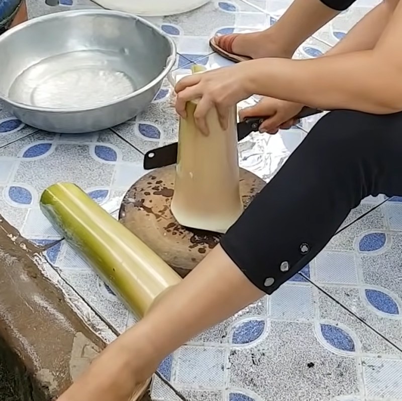 Step 1 Prepare the banana tree for Sour Soup with Dried Dory Fish and Grated Banana