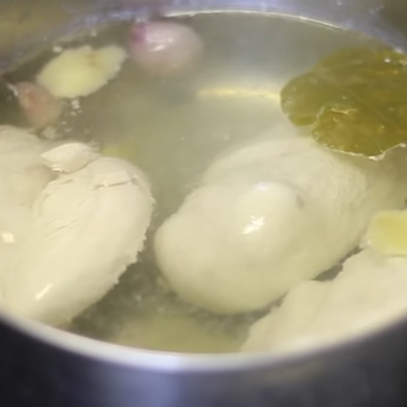 Step 1 Prepare, boil chicken and shred chicken Spicy Shredded Dried Chicken using a pan