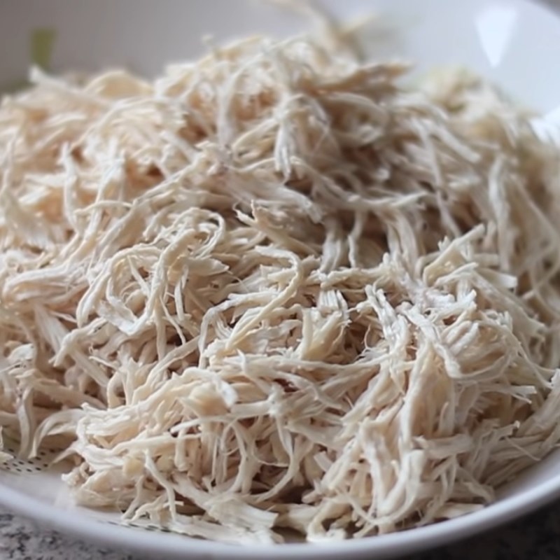 Step 1 Prepare, boil chicken and shred chicken Spicy Shredded Dried Chicken using a pan