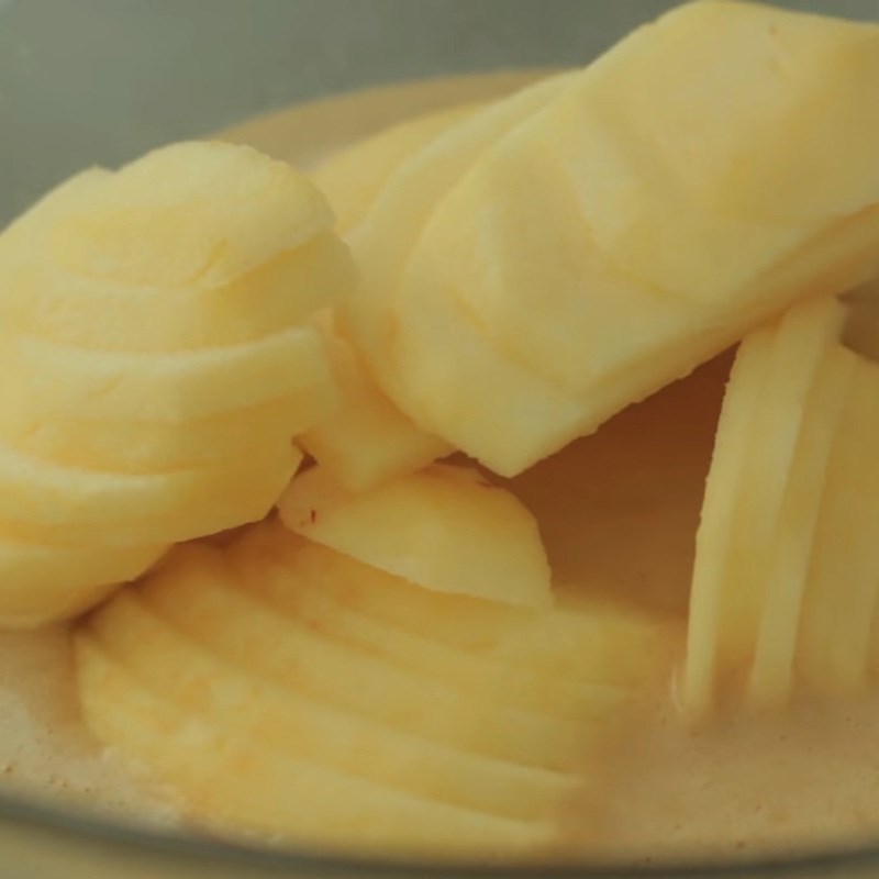 Step 3 Mixing the apples with the batter for Invisible Apple Pie