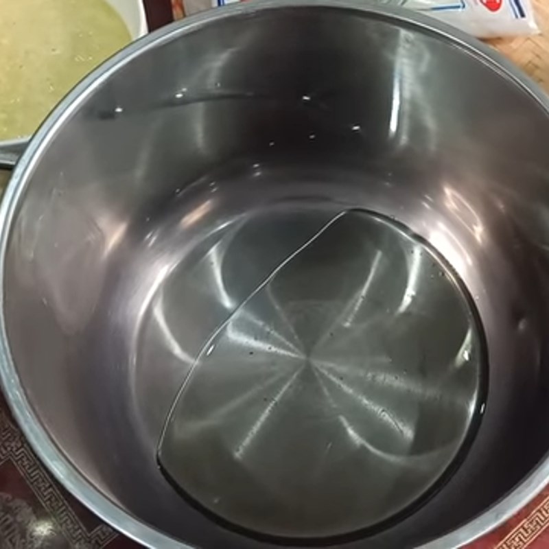 Step 2 Mixing and cooking the crushed gac mixture Gac lam dessert