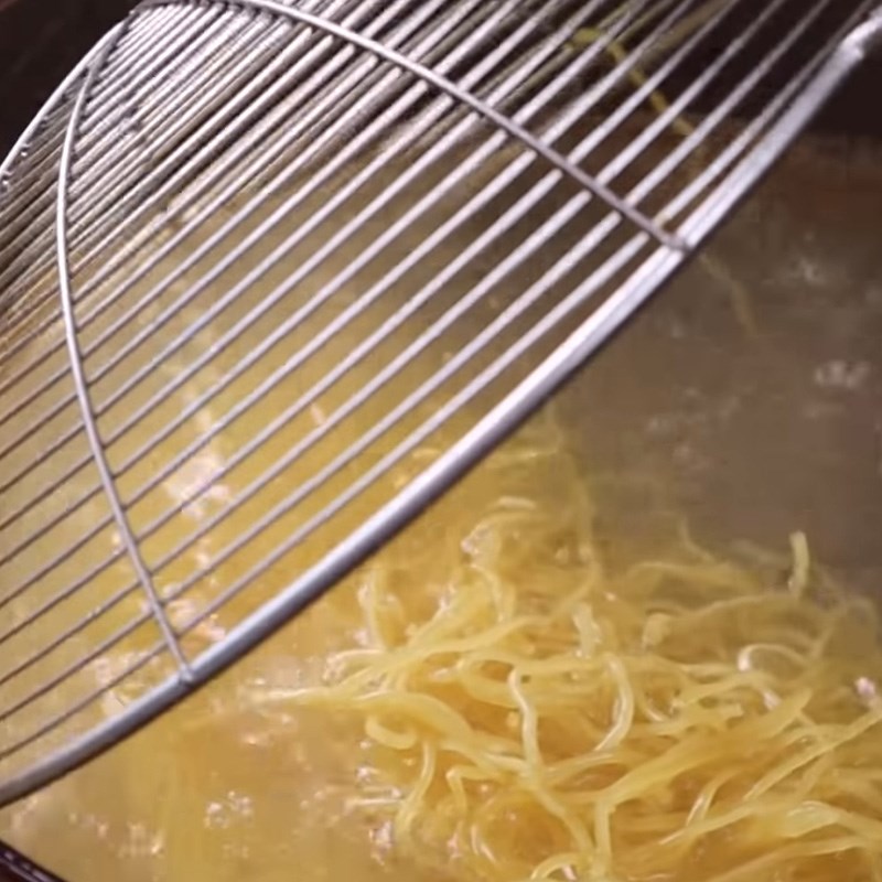 Step 7 Blanching the noodles Chicken noodles fried in a pan