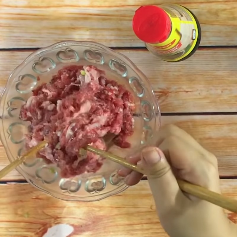 Step 1 Marinate the pork for Stuffed Bitter Melon with Soy Sauce