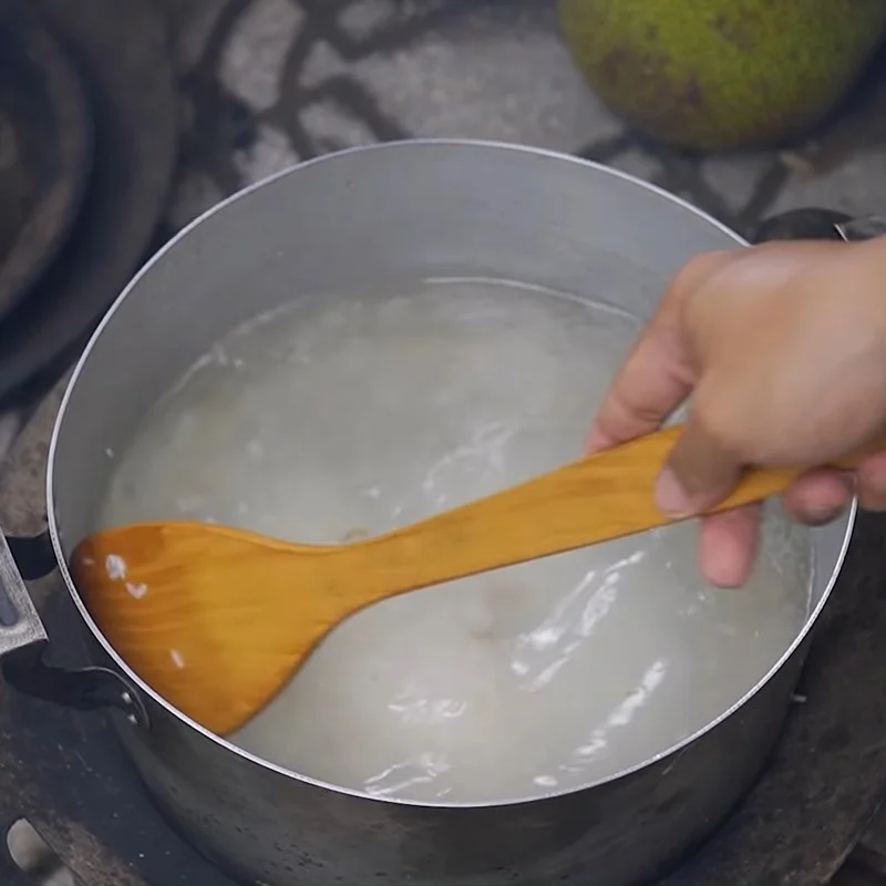 Step 2 Sauté the rice and cook the porridge for Beef Mushroom Porridge