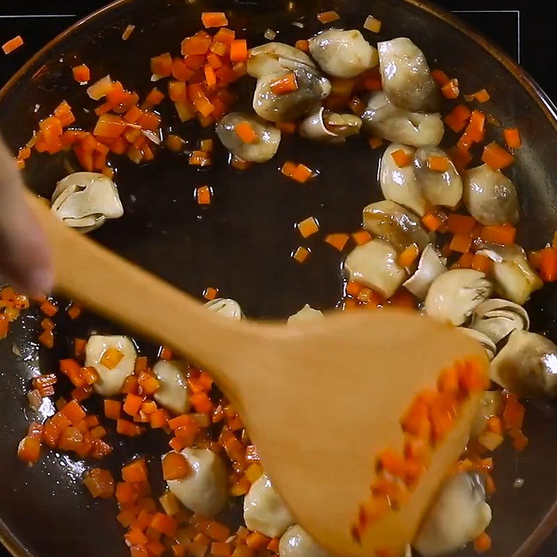 Step 2 Stir-fry ingredients for straw mushroom porridge