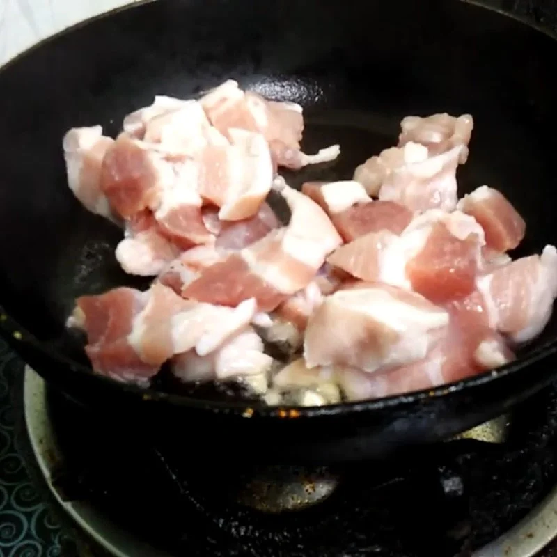 Step 2 Stir-fried meat Salted squid with pork belly