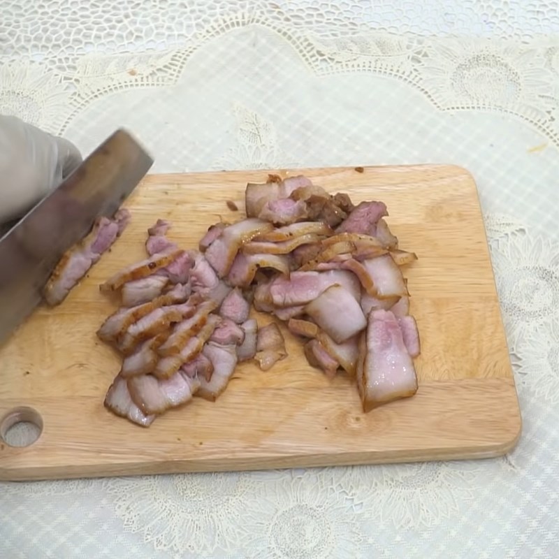 Step 6 Sautéing shrimp, quail eggs, and meat for Phu Chiêm Quang noodles